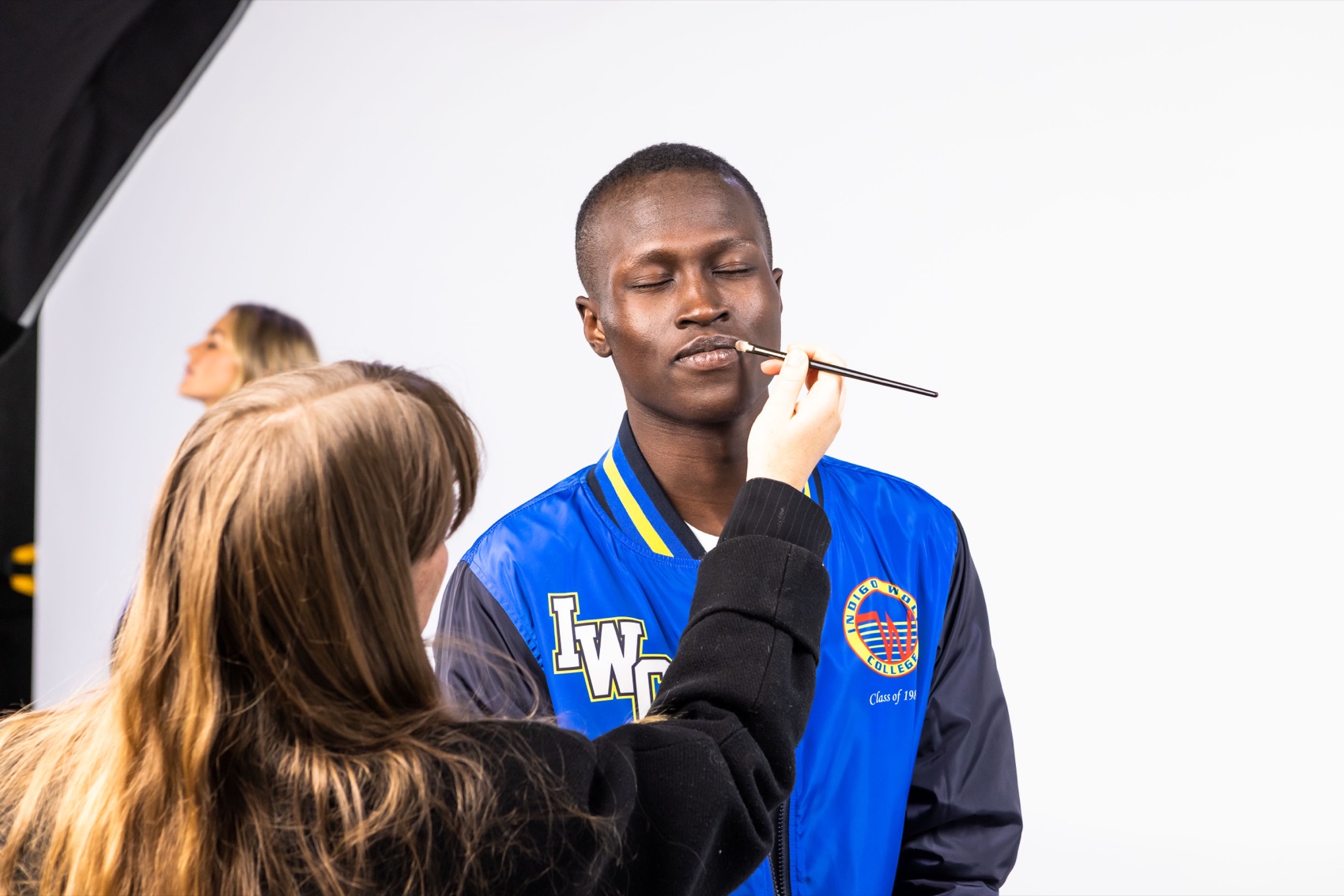 Makeup being applied on set between shots