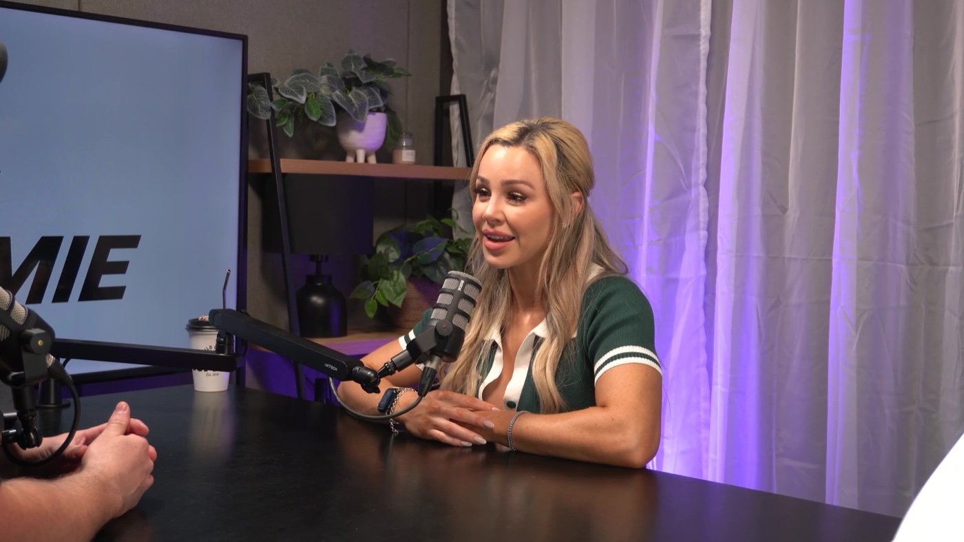 A guest interview under coloured studio lighting