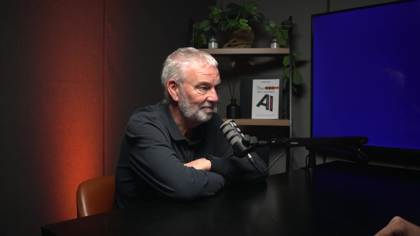 A host recording under warm studio lighting