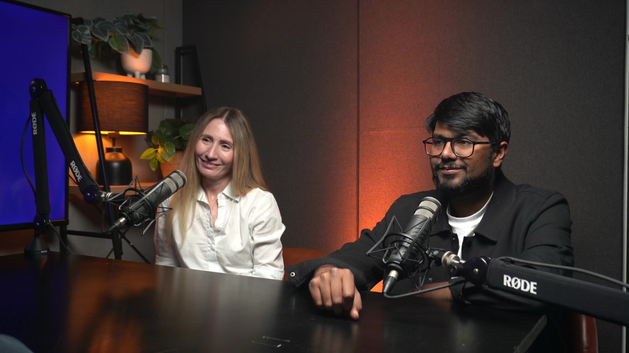 Hosts recording a podcast at RODE microphones in the studio